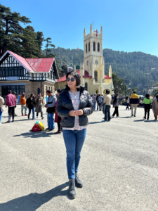 Solo Travel - Wandering amidst the beauty of Ridge, Shimla: Exploring the charming streets with a backdrop of lush mountains and blue skies.